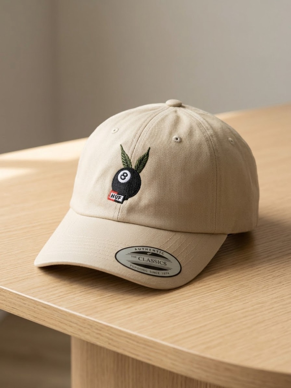 HUF Beige Baseball Cap with Black 8-Ball and Green Leaf Patch